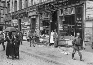 Reality in the streets of a famished Germany, where food shops had to be guarded by the military.